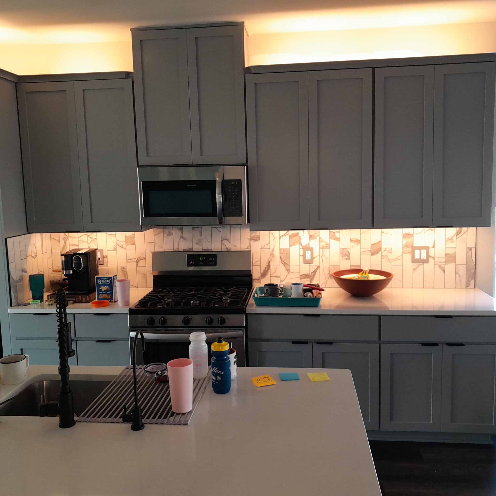 New lighting installed over kitchen counters and cabinets