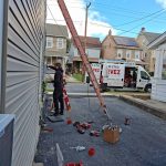 Electrician from Estevez Electrical LLC working on electric meter